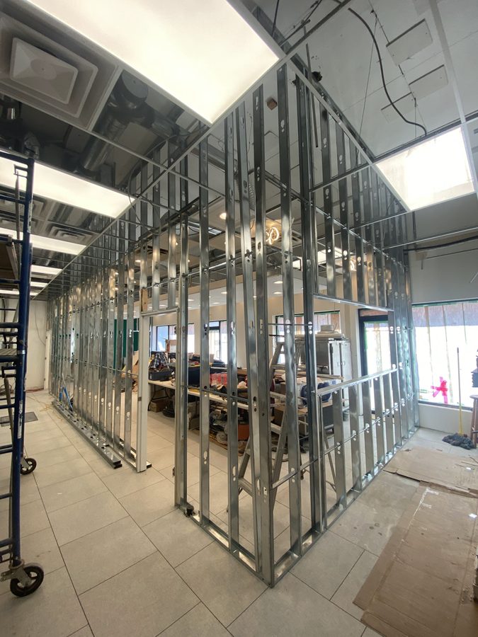 New steel stud partition framing in a bright office